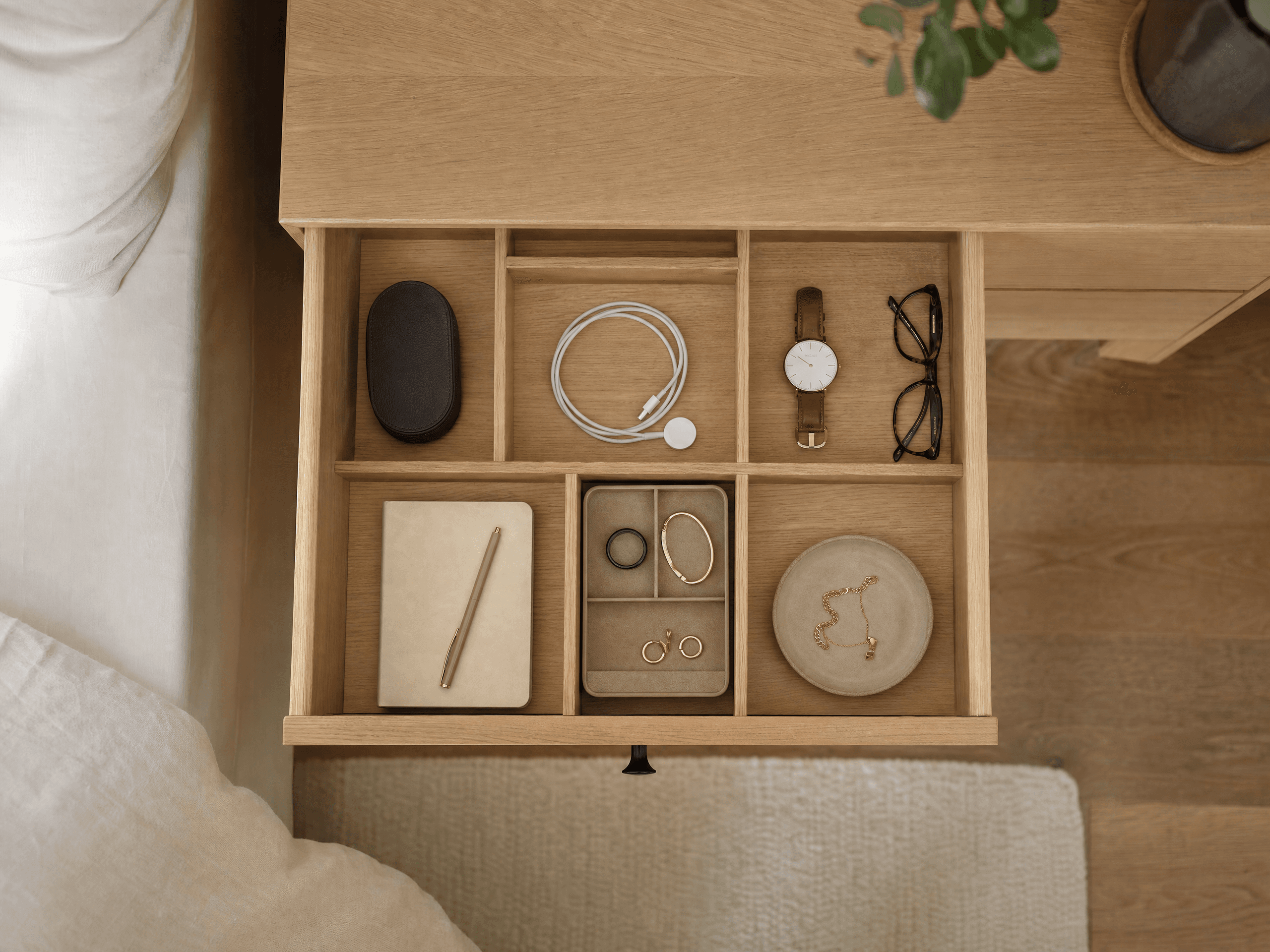 Organized bedroom drawer with compartments for small everyday items